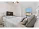 Bedroom with ceiling fan and dresser at 20252 Lagente Cir, Venice, FL 34293