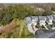 Aerial view of homes surrounded by lush trees; highlighting the neighborhood's beautiful natural setting at 3203 Audubon Ct, Tarpon Springs, FL 34688