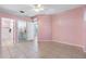 Tile floored pink bedroom showing ensuite bathroom and walk-in closet at 3203 Audubon Ct, Tarpon Springs, FL 34688