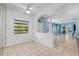 Dining area with view of living room and access to screened porch at 3203 Audubon Ct, Tarpon Springs, FL 34688