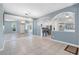 Bright dining room with tile floors and view into the kitchen at 3203 Audubon Ct, Tarpon Springs, FL 34688