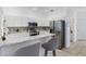 Bright kitchen featuring stainless steel appliances and granite countertops at 3203 Audubon Ct, Tarpon Springs, FL 34688