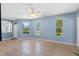 Living room with light blue walls, tile floors, and lots of natural light at 3203 Audubon Ct, Tarpon Springs, FL 34688
