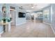 Spacious living room features tile flooring, soft blue walls, and ample natural light at 3203 Audubon Ct, Tarpon Springs, FL 34688