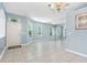 Bright, airy living room with tile floors, high ceilings, and multiple windows at 3203 Audubon Ct, Tarpon Springs, FL 34688