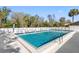 Inviting swimming pool surrounded by a well-maintained fence and patio area for endless summer fun at 3203 Audubon Ct, Tarpon Springs, FL 34688