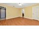 Bright bedroom with wood-look floors and access to bathroom at 3826 Highgate Dr, Valrico, FL 33594