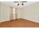 Spacious bedroom featuring wood floors and ceiling fan at 3826 Highgate Dr, Valrico, FL 33594