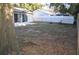 Large backyard featuring a combination of wood and vinyl fencing and an outdoor gazebo at 6741 Willits Ave, New Port Richey, FL 34655
