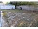 Spacious backyard with wood and chainlink fencing, featuring a grill and a gazebo at 6741 Willits Ave, New Port Richey, FL 34655