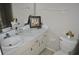 Bathroom featuring a white marble-look countertop, decorative accents, and a neutral color scheme at 6741 Willits Ave, New Port Richey, FL 34655