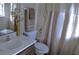 Bathroom featuring a shower, toilet and sink at 6741 Willits Ave, New Port Richey, FL 34655