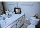 Bathroom featuring a white marble-look countertop, decorative accents, and a neutral color scheme at 6741 Willits Ave, New Port Richey, FL 34655