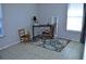 Neutral bedroom featuring a desk, chair, mirror, and floral rug enhancing the room's character at 6741 Willits Ave, New Port Richey, FL 34655