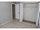 Spacious closet with white bi-fold doors and ample shelving for organized storage at 6741 Willits Ave, New Port Richey, FL 34655