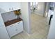 Tiled hallway that leads to a seating area and the kitchen at 6741 Willits Ave, New Port Richey, FL 34655