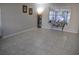 Spacious living room with neutral walls, tile floors, and plenty of natural light at 6741 Willits Ave, New Port Richey, FL 34655