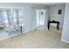 Bright living room featuring tile floors, sliding glass doors, and neutral decor at 6741 Willits Ave, New Port Richey, FL 34655