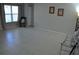 Large, open living room with tile flooring, and a large window offering natural light at 6741 Willits Ave, New Port Richey, FL 34655