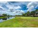 Picturesque golf course with homes and lake views at 8037 Shaddock Pl, Land O Lakes, FL 34637