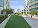 Landscaped courtyard with artificial turf and potted plants at 912 Channelside Dr # 2601, Tampa, FL 33602