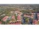 Aerial view showing community, pool, and surrounding landscape at 9481 Highland Oak Dr # 807, Tampa, FL 33647