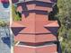 Top-down view of red-tiled roofs of multiple condo units at 9481 Highland Oak Dr # 807, Tampa, FL 33647