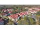 Condo building with red roofs and landscaping at 9481 Highland Oak Dr # 807, Tampa, FL 33647