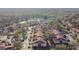 Aerial view of a large condo community with a pool and lake at 9481 Highland Oak Dr # 807, Tampa, FL 33647