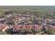 Aerial view of a large condo community with a lake nearby at 9481 Highland Oak Dr # 807, Tampa, FL 33647