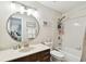 Clean bathroom with a vanity, toilet, and bathtub at 9481 Highland Oak Dr # 807, Tampa, FL 33647