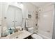 Clean bathroom with tub shower combo, updated vanity, and tile flooring at 9481 Highland Oak Dr # 807, Tampa, FL 33647