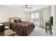Bedroom with ceiling fan, window, and ample space at 9481 Highland Oak Dr # 807, Tampa, FL 33647