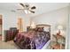 Spacious bedroom with ceiling fan and ensuite access at 9481 Highland Oak Dr # 807, Tampa, FL 33647