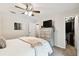 Spacious bedroom with large closet, dresser, and ceiling fan at 9481 Highland Oak Dr # 807, Tampa, FL 33647