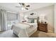 Bedroom with queen-size bed and ceiling fan at 9481 Highland Oak Dr # 807, Tampa, FL 33647