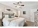 Relaxing bedroom featuring a ceiling fan and stylish decor at 9481 Highland Oak Dr # 807, Tampa, FL 33647