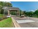 Gated community entrance with stone pillars and landscaping at 9481 Highland Oak Dr # 807, Tampa, FL 33647