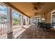Covered patio with seating area and ceiling fans at 9481 Highland Oak Dr # 807, Tampa, FL 33647