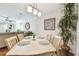 Casual dining area with light wood table, chairs, and living room view at 9481 Highland Oak Dr # 807, Tampa, FL 33647