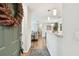 Inviting entryway with wood floors and view into living room at 9481 Highland Oak Dr # 807, Tampa, FL 33647