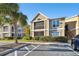 Condo building exterior with palm trees and parking at 9481 Highland Oak Dr # 807, Tampa, FL 33647