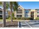 Condo building exterior with palm trees and parking at 9481 Highland Oak Dr # 807, Tampa, FL 33647
