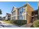 Two-story condo building with red tile roofs and landscaping at 9481 Highland Oak Dr # 807, Tampa, FL 33647