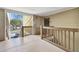 Interior hallway with wooden railings and access to unit at 9481 Highland Oak Dr # 807, Tampa, FL 33647