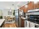 Kitchen with stainless steel appliances and wood cabinets at 9481 Highland Oak Dr # 807, Tampa, FL 33647