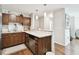 Modern kitchen with stainless steel appliances and wood cabinets at 9481 Highland Oak Dr # 807, Tampa, FL 33647