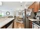 Eat-in kitchen with stainless steel appliances and view of dining area at 9481 Highland Oak Dr # 807, Tampa, FL 33647