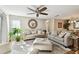 Relaxing living room with hardwood floors, neutral furniture, and natural light at 9481 Highland Oak Dr # 807, Tampa, FL 33647