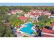 Aerial view of a community pool with surrounding lounge chairs and umbrellas at 9481 Highland Oak Dr # 807, Tampa, FL 33647
